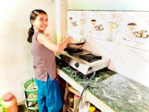 Srijana, class-5 practicing cooking.