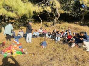 Children enjoying picnic at park.