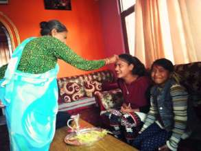 DURGA and SRIJANA is taking red color, blessing.