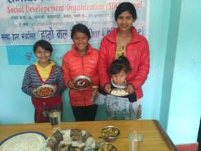 Children happy with sweets at  Maghe Sakranti fest