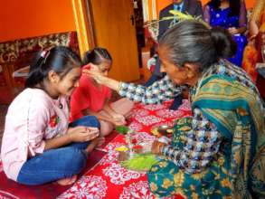 Children celebrating Dashain with TIKA(color)