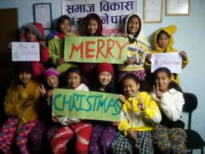 Children wishing MERRY-CHRISTMAS to all supporters