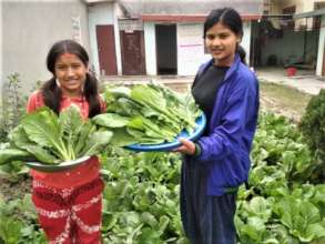 Children happy with vegetables they produced.