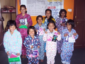 Children happy with Pyjama donated by Leila-Aus.