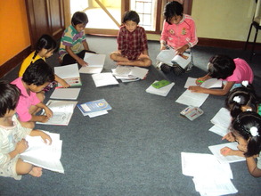 Children busy on their home work