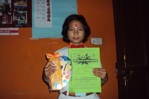 Rani (Priya) happy with her prize and certificate