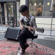 One young guitarist performing for the first time