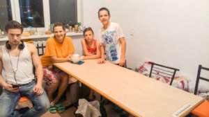 The Mamyrbaev family with their new furniture