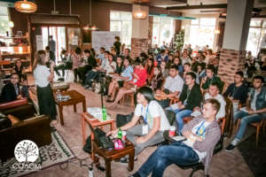 The main session underway in the cafe, full house