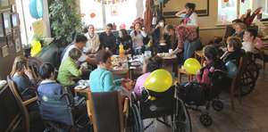 Having fun at the social club for disabled people