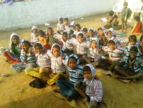 Distributing warm clothes: Satellite school Ladar