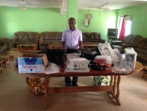 Dr. Fofie with the cervical cancer supplies.
