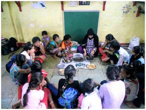 Girls observing the chocolate making process!