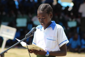 Young girl reads story out loud at ILD 2015 event