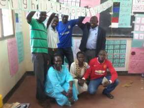 Teachers and master trainers at training session.
