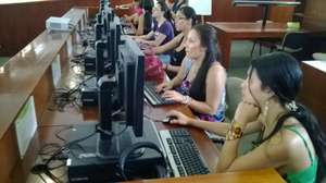 Some students using a computer for the first time