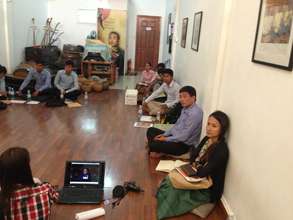 Scholarship Students Watching Debate Video