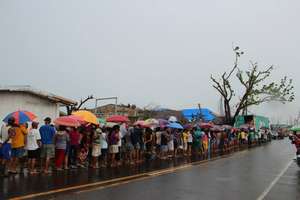 A long-line of survivors awaiting for relief