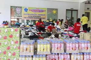 CJFI volunteers in the repacking of goods