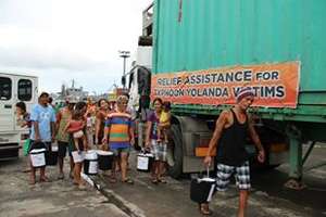 Survivors receiving CJFI relief goods