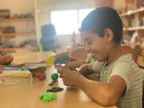 A child playing with clay