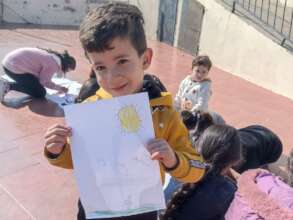 A child drawing the story characters