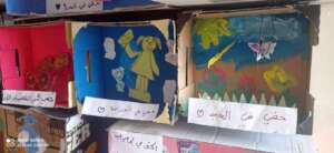 Children showcasing their work in the exhibition