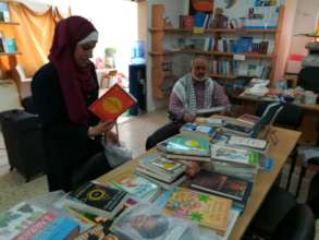 Happy librarian & Major Haj Sami when books arrive