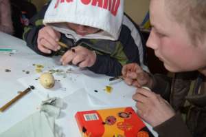 Practicing traditional ornamenting of Easter eggs