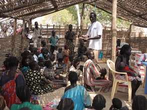 Mothers & children await treatment in an IDP camp