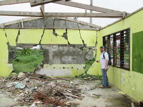 Eric inspecting damaged schools