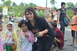 Lourdes Damazo with school child in Borongan