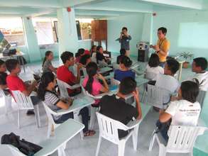 Mentor giving a speech to other classmates