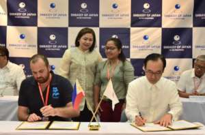 Signing the contract to build new classrooms!
