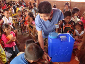 Demonstrating proper hand washing techniques