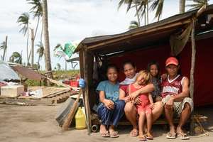 Sara and her family in makeshift shelter