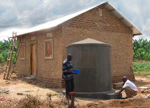 Rain harvesting tank and roof from metal sheets