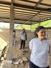 DARE Staff inspect the building progress