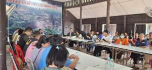 Camp leaders and NGO staff meet about emergency