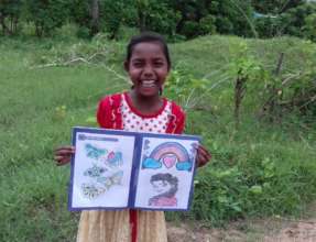Child is happy in colouring the pictures