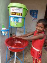 Handwash station use by child