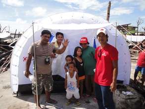 A family in Guiuan, Samar receives a tent from CF