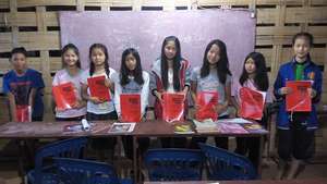 Some students with their new grammar books