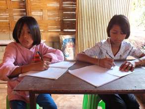 Two girls practice their Burmese Language skills