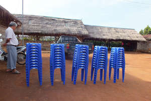 The camp headman & 50 new bright blue stools