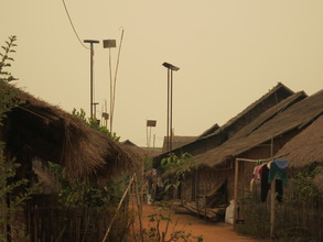 solar panels line the view of the refugee camp