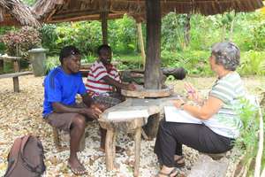Sandrine w/ Joseph and Mabong, planning training.