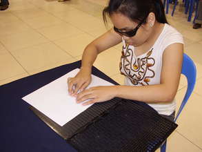 Julyn learns to read and write using braille