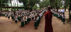 Morning assembly with head monk