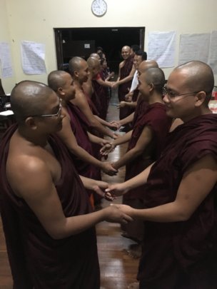 Monks and nuns closing circle for learning trip